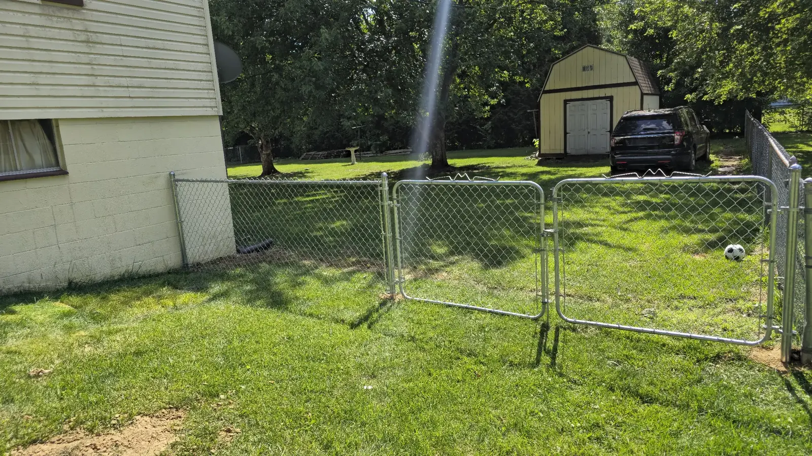 Completed chain-link fence with double gate in Maugansville, Washington County, Maryland