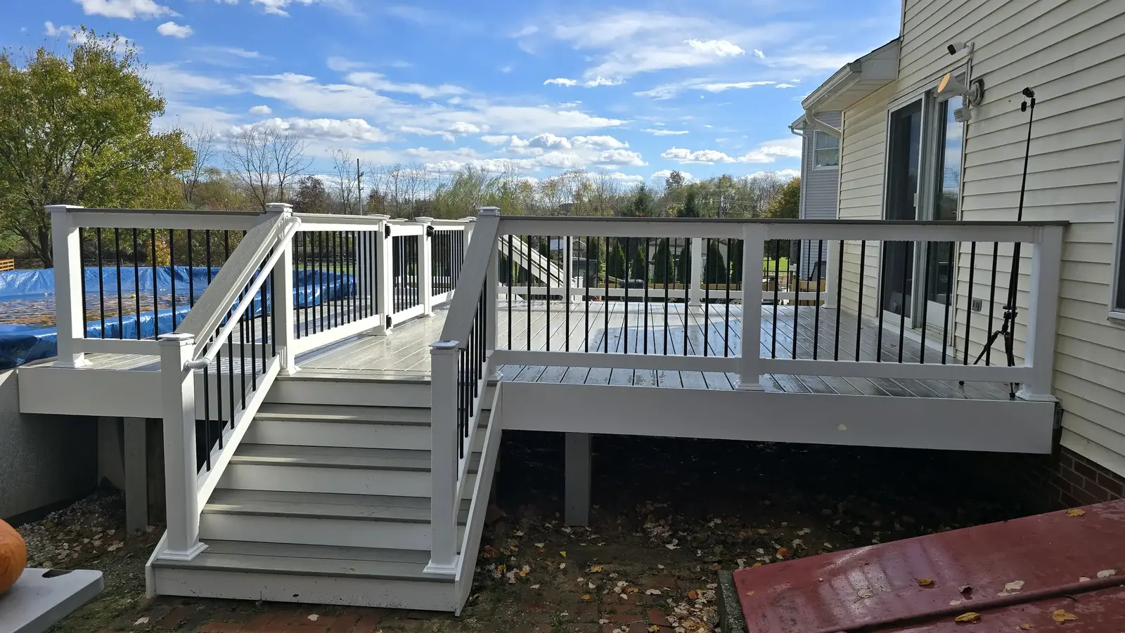 Composite backyard deck with wide stairs built by Darling Builders in Maryland