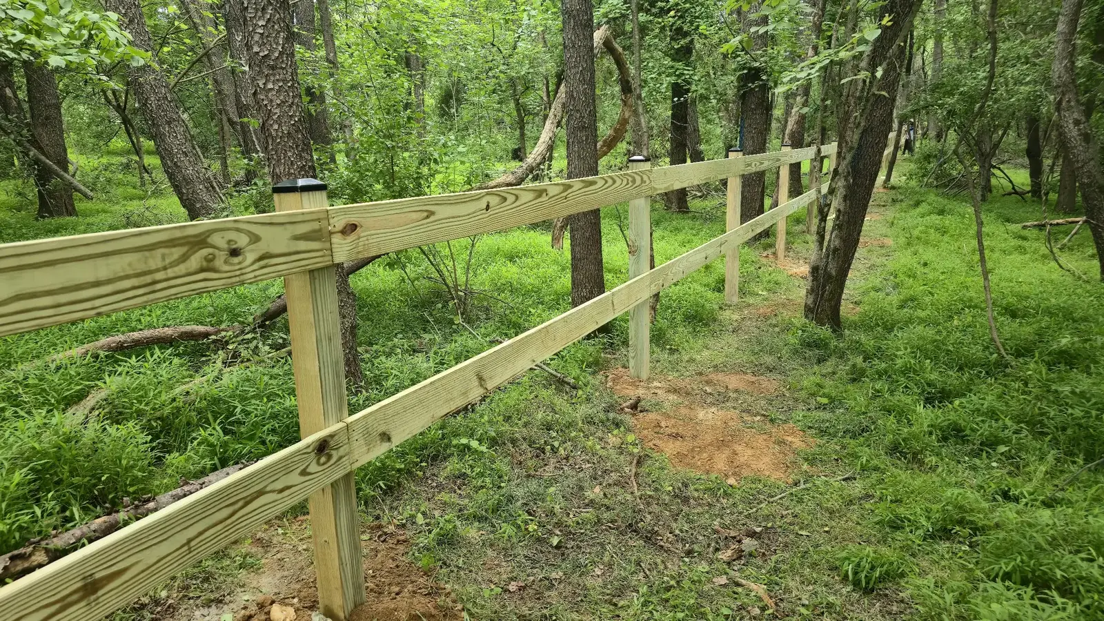430-foot two-board paddock fence installed by Darling Builders in Mount Airy, Maryland